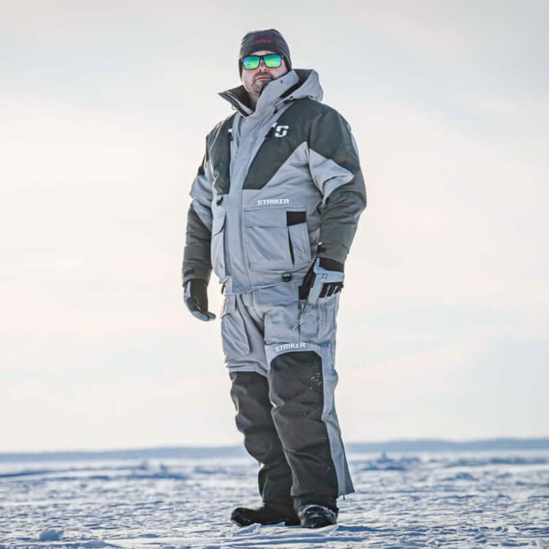 Person wearing a Apex ice fishing suit on a frozen lake.